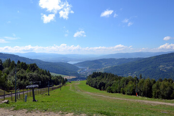 Fototapeta na wymiar Panoramic view from Zar Mountain, Poland. View of Beskidy Mountains, Zywieckie Lake. Small Beskid region of Poland 