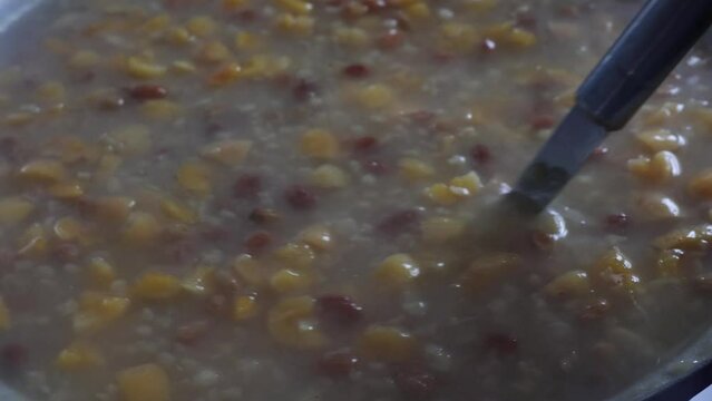 Asure or Noah's Pudding. Homemade asure making background 4k video. Traditional Turkish desserts.