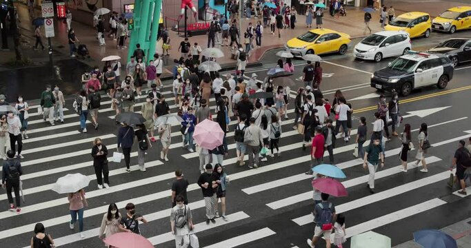 Pedestrian walk in the street in Taipei city in rain day