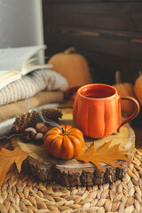 Smoke from an extinguished candle and a cup of tea, autumn composition