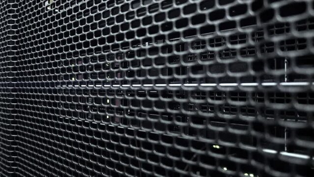 Server with many HDD disks inside rack in server room.