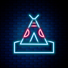 Glowing neon line Traditional indian teepee or wigwam icon isolated on brick wall background. Indian tent. Colorful outline concept. Vector