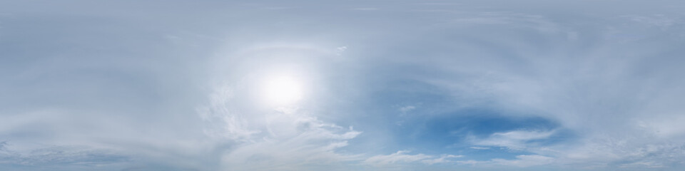 blue sky hdri 360 panorama with halo and white beautiful clouds in seamless panorama with zenith for use in 3d graphics or game development as sky dome or edit drone shot for sky replacement