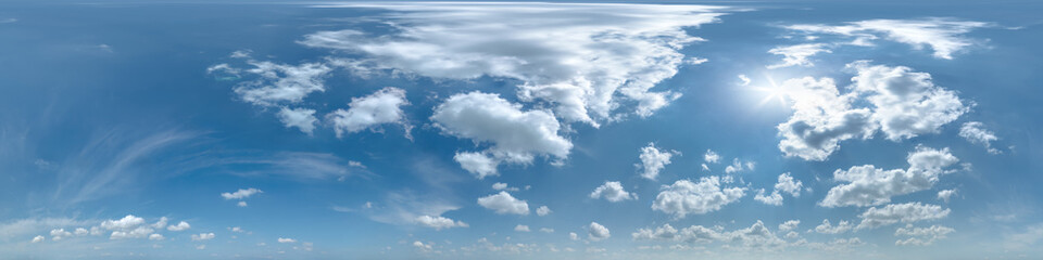 blue sky with beautiful clouds as seamless hdri 360 panorama view with zenith for use in 3d graphics or game development as sky dome or edit drone shot