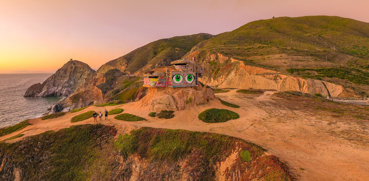 Aerial: scenic sunset over the ocean and mountains. Drone view 