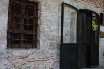 The big black door and window of the room that hosts the workshops in karak&ouml;y 