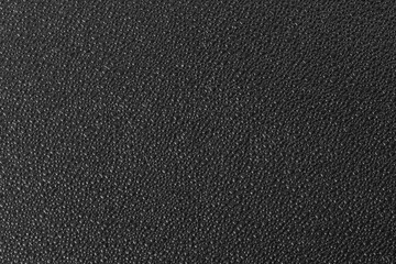 Black textured plastic surface