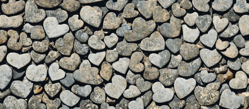 A wall made of heart shaped stone blocks, 3d render