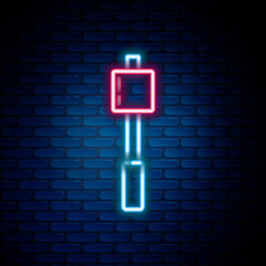Glowing neon line Marshmallow on stick icon isolated on brick wall background. Colorful outline concept. Vector