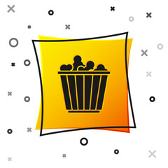Black Popcorn in cardboard box icon isolated on white background. Popcorn bucket box. Yellow square button. Vector