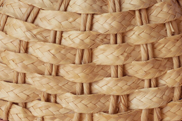 Weaving from branches of a dry vine. Folk craft of the countryside. Texture plexus from natural branches