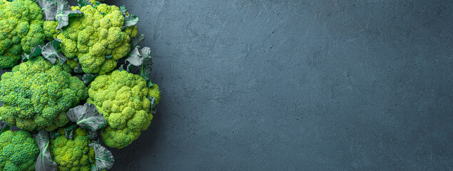 Broccoli on a dark graphite background. Healthy, dietary food. Top view, copy space. Culinary...