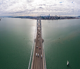 Aerial: bridge over the ocean in the morning. Drone view