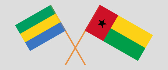 Crossed flags of Gabon and Guinea-Bissau. Official colors. Correct proportion