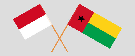 Crossed flags of Monaco and Guinea-Bissau. Official colors. Correct proportion