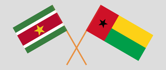 Crossed flags of Suriname and Guinea-Bissau. Official colors. Correct proportion