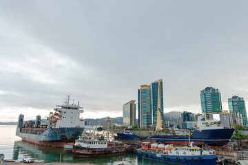 Wharf ship Port of Spain Trinidad waterfront skyscraper city sea - obrazy, fototapety, plakaty