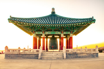 Panoramic traditional Korean design temple, gazebo, structure in the park at sunset 