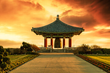 Obraz premium Beautiful traditional Korean design temple, gazebo, structure in the park at sunset 