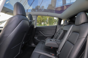 Passenger seats inside the car with panoramic roof