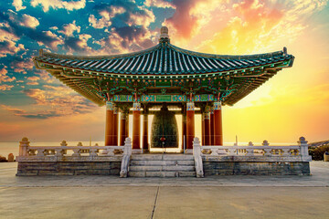 Epic traditional Korean design temple, gazebo, structure in the park at sunset 