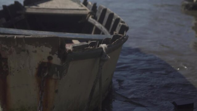 Detail of small boat moored on the beach. Ribeiro Beach, state of Espirito Santo - Brazil.