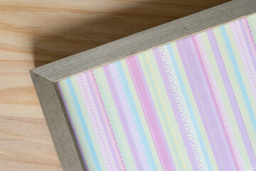 wood frame panel with scrapbook paper (with vertical stripes)