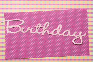 Birthday greeting on paper with pattern