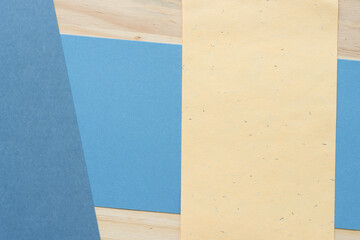 paper background - blue, yellow, and wood