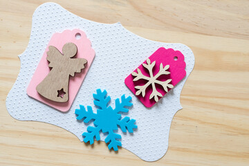 Christmas themed background with snowflake and gift tags feat. angel and snowflake or star
