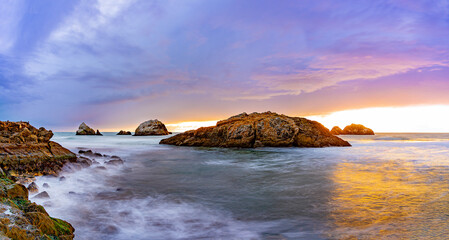 Panorama sunset over the ocean at Land’s End beach
