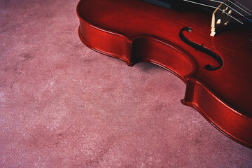 violin on pink textured background