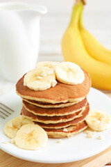 Fototapeta na wymiar Plate of banana pancakes on table, closeup