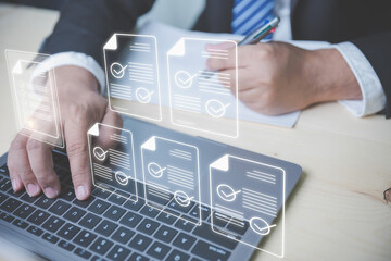 Sign electronic signature, paperless, technology, electronic, and management concept. Hand of a businessman using laptop computer with virtual screen and document for online approve.