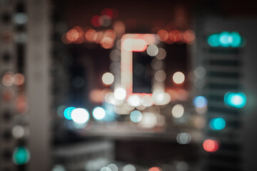 Blurred bokeh city lights background with reddish and teal defocused neon illumination - Powered by Adobe