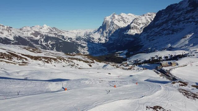 Grindelwald, Switzerland: Aerial drone footage of the Jungfrau region ski resort near the Kleine Scheidegg train station in the Berner Oberland alps near Interlaken in Switzerland