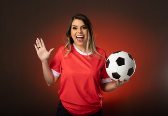 woman soccer fan cheering for her favorite club and team. world cup red background