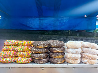 donuts served on the wooden shelf to be traded