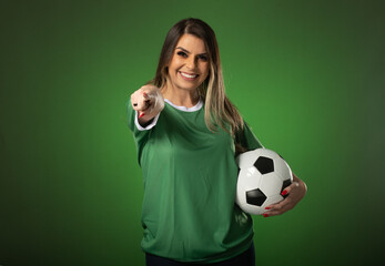 woman soccer fan cheering for her favorite club and team. world cup green background