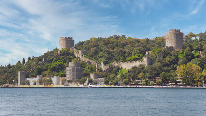 Fototapeta premium Ruins of Rumelihisari, Bogazkesen Castle, or Rumelian Castle, in a summer day, located at the hills of the European side of Bosphorus Strait, Istanbul, Turkey, built by Ottoman Sultan Mehmet II