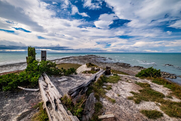 Fototapeta na wymiar Derelict structure on Cape Campbell with Pacific ocean view on the South Island of New Zealand