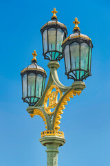 Fototapeta na wymiar Closeup of one of the electric lamps on Westminster Bridge at London UK, taken on Sept 21, 2022.