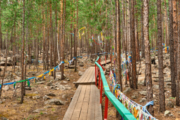 Fototapeta premium Datsan - Palace of the goddess Yanzhima on a clear summer day, Barguzinskaya Valley, Buryatia, Russia.