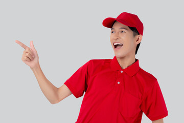 Young asian man in uniform red and cap standing presenting with excited isolated on white background, employee or dealer show, courier and delivery, deliveryman and expression, logistic and cargo.