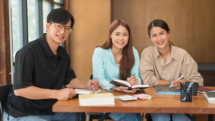 Education concept, Female tutor and students smiling and looking on camera while study tutorial