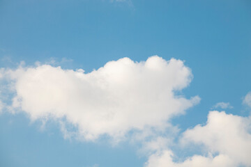 Fototapeta premium Clouds in the blue sky. Summer blue sky cloud gradient light white background. Beauty clear cloudy in sunshine calm bright winter air background. Gloomy vivid cyan landscape in environment day.