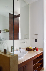Spacious bathroom in gray tones with heated floors, freestanding tub.