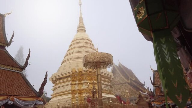 view of golden pagoda Phrathat Doi Suthep Temple in chiang mai northern of Thailand in slowmotion