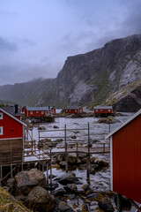 red cabins in the mountains, Lofoten Islands, mountains in the background