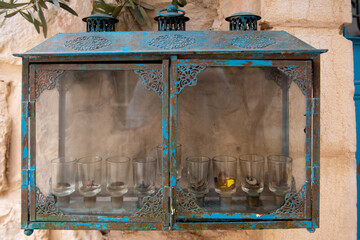 A Hanukkah menorah typical of those used in Israel with a special glass housing to protect the burning oil from wind and rain during the eight-day Jewish festival.